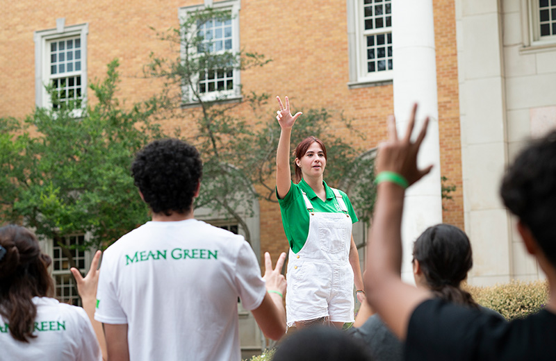 An eagle ambassador guiding prospective students.