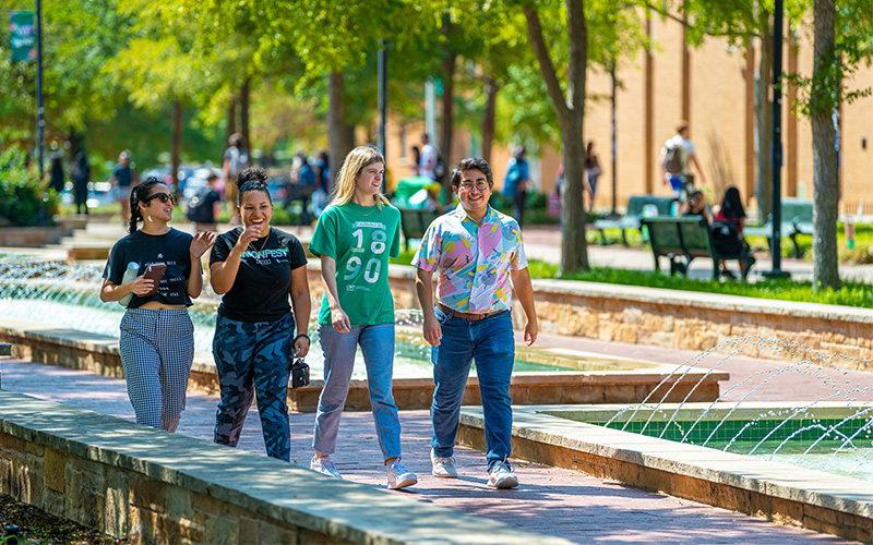 Students walking across campus. 